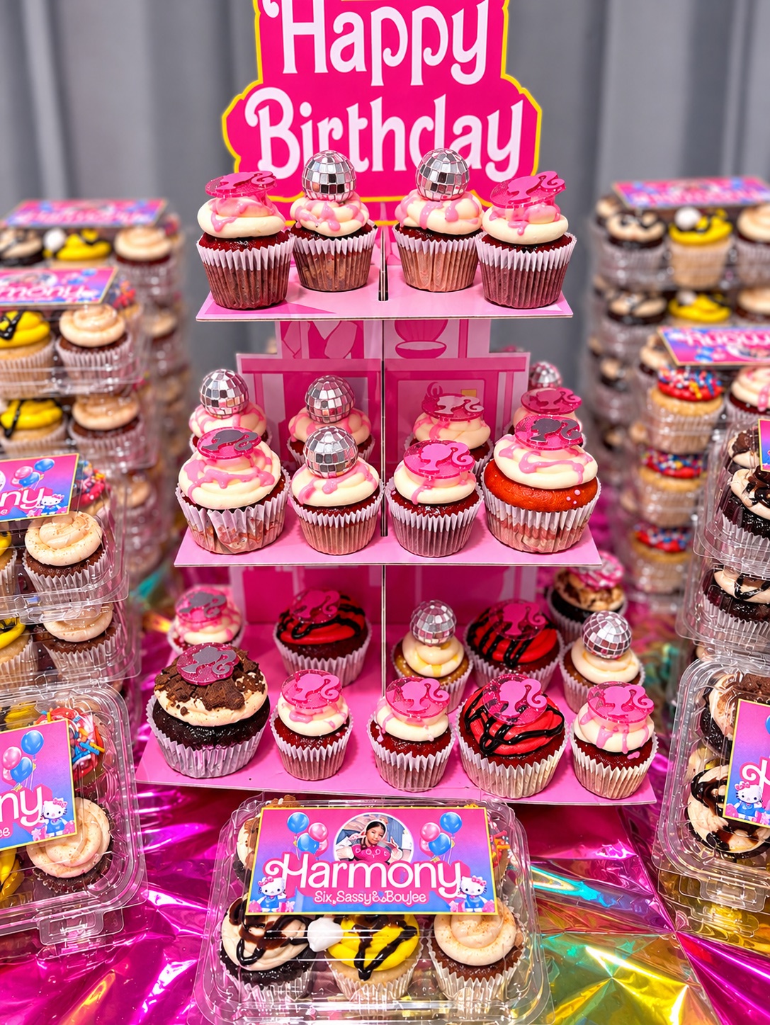 Birthday cupcake display with pink party decorations